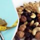 Left: spoon with a yellow measuring tape on a blue background, right: mixed nuts in a bowl, suggesting healthy snacking or dieting.