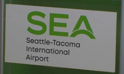 SEA sign for Seattle-Tacoma International Airport with green logo and text 'SEA' and 'Seattle-Tacoma International Airport'