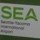 SEA sign for Seattle-Tacoma International Airport with green logo and text 'SEA' and 'Seattle-Tacoma International Airport'