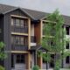 Modern townhouse building with three stories, black/gray siding, orange-brown trim, and balconies surrounded by trees.