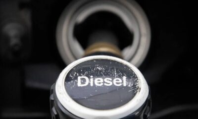 Close-up of a diesel fuel cap on a dark vehicle surface