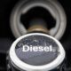 Close-up of a diesel fuel cap on a dark vehicle surface