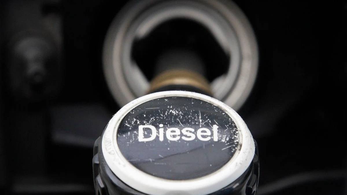 Close-up of a diesel fuel cap on a dark vehicle surface