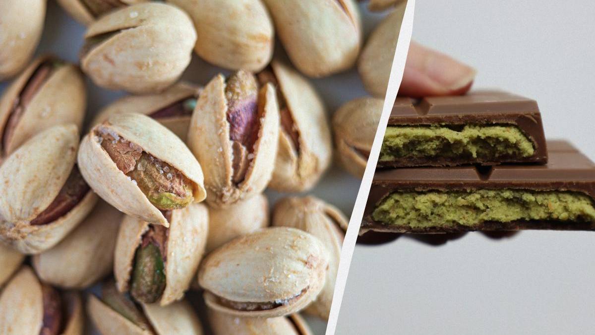 Pile of pistachio nuts on the left and pistachio-filled chocolate bars on the right, split by a diagonal divider.