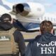 U.S. Marshals and HSI officers walk toward a private jet on the airport tarmac, seen from the back with tactical gear on.