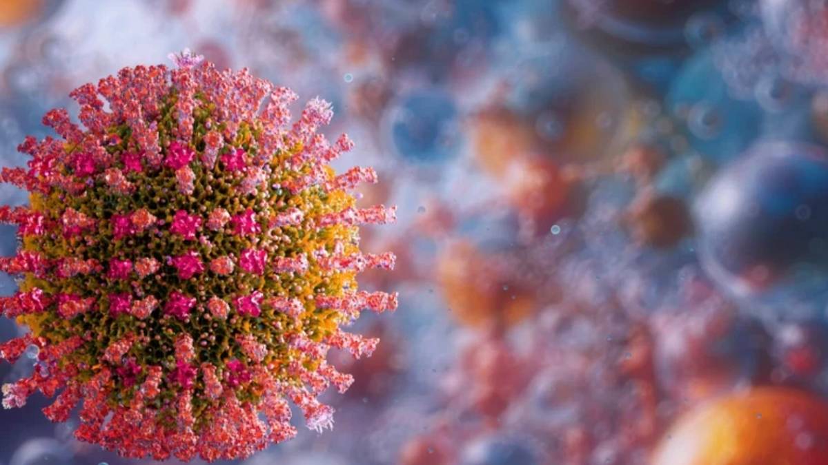 Close-up of a coronavirus particle with pink spike proteins against a blurred background, illustrating the virus structure.