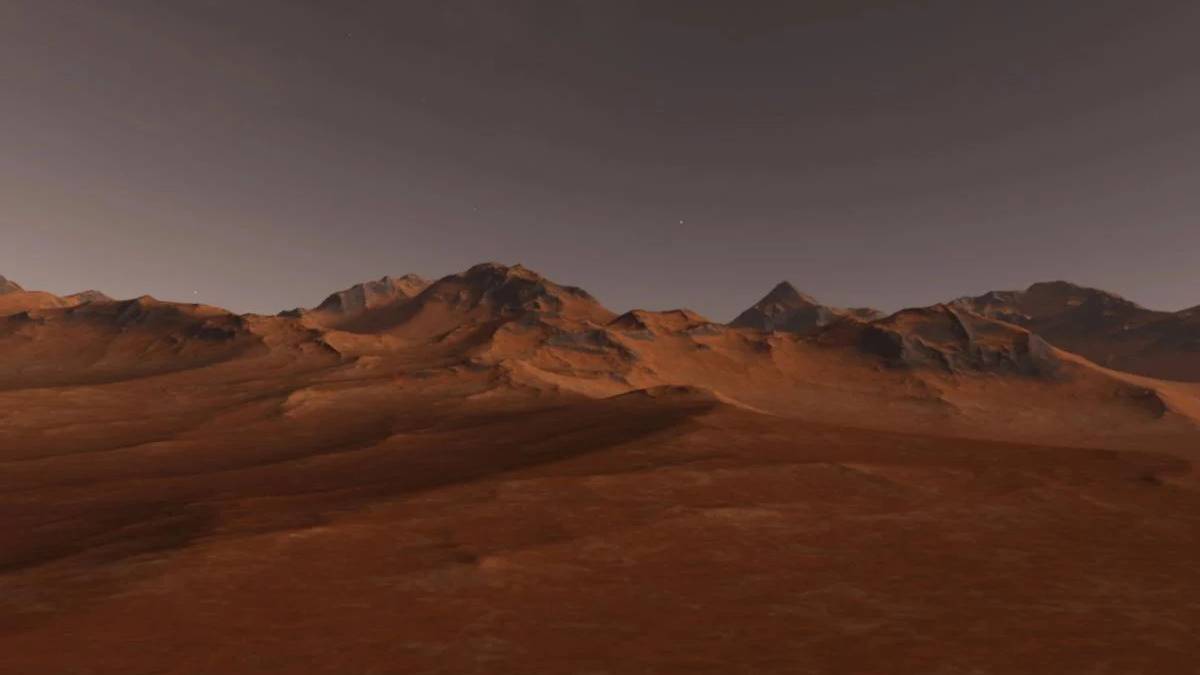 Desert plain in orange-red tones with a rocky mountain range on the horizon under a dusky sky, twilight light.