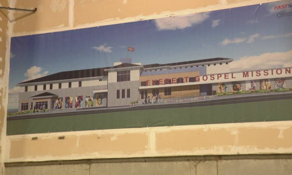 Rendering of Everett Gospel Mission building with banners and sculptures on a grassy foreground, labeled 'EVERETT GOSPEL MISSION'.