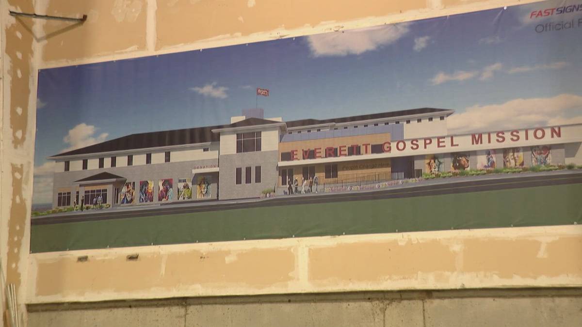 Rendering of Everett Gospel Mission building with banners and sculptures on a grassy foreground, labeled 'EVERETT GOSPEL MISSION'.