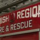Red fire department vehicle side with white 'Snohomish Regional Fire & Rescue' lettering and a small emergency light above.