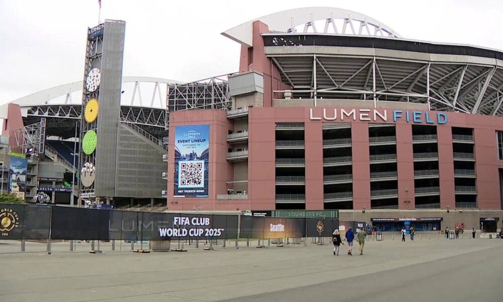 Lumen Field exterior with a tall tiered clock tower and banners advertising the FIFA Club World Cup 2025 outside the stadium