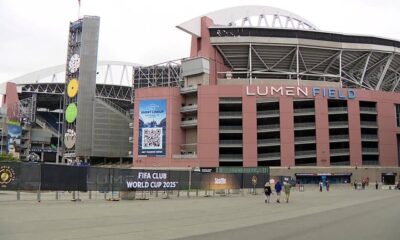 Lumen Field exterior with a tall tiered clock tower and banners advertising the FIFA Club World Cup 2025 outside the stadium