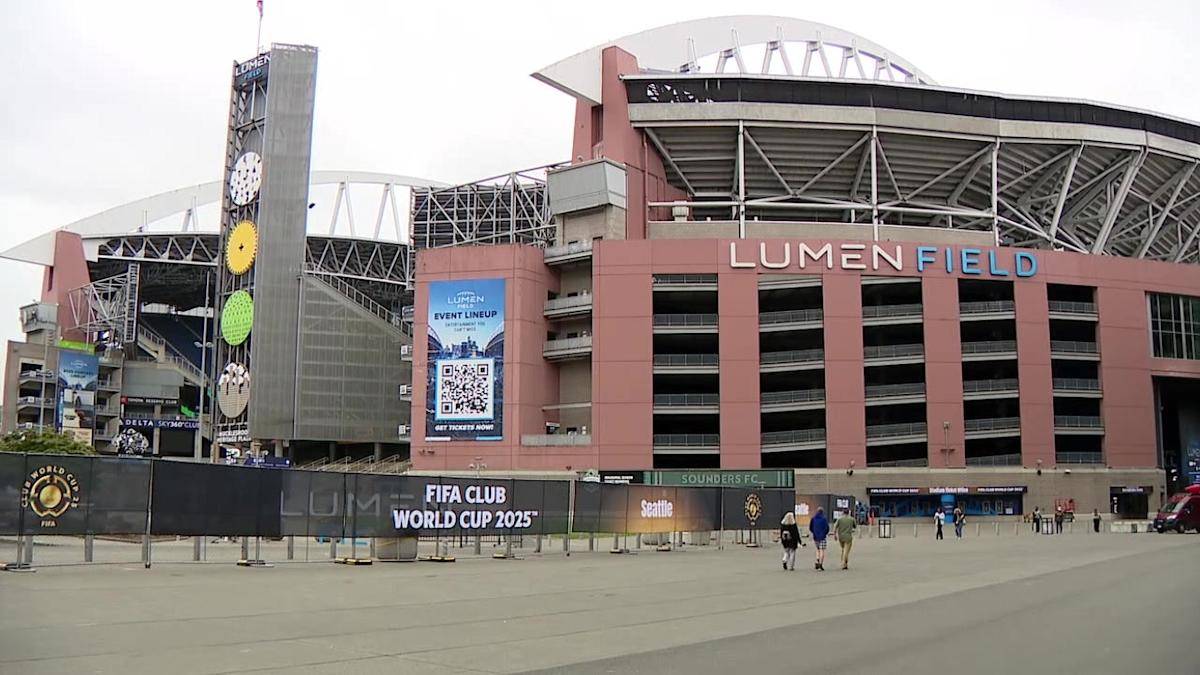 Lumen Field exterior with a tall tiered clock tower and banners advertising the FIFA Club World Cup 2025 outside the stadium