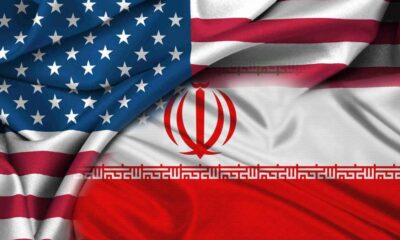 Composite image blending the United States flag with the Iranian flag, implying U.S.–Iran relations.