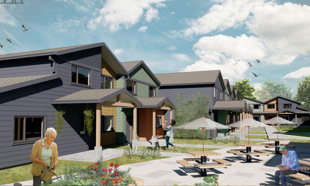 Row of modern townhouses with a shared outdoor seating area and residents gardening and walking nearby.