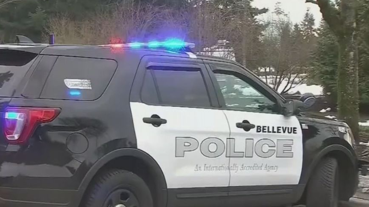 Bellevue Police SUV with blue and red emergency lights flashing, side view