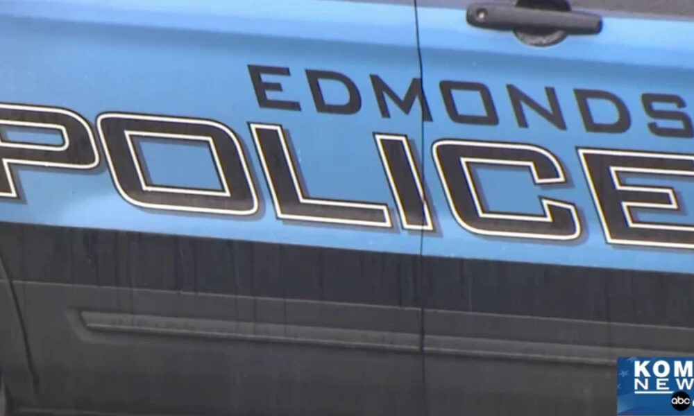 Blue police car with 'EDMONDS POLICE' lettering on the side and a KOMO News watermark in the lower-right corner.