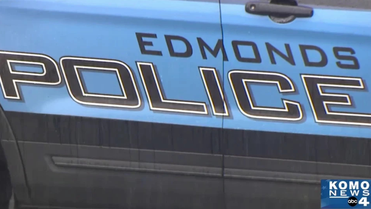 Blue police car with 'EDMONDS POLICE' lettering on the side and a KOMO News watermark in the lower-right corner.