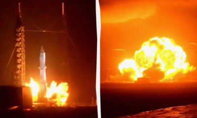 Rocket on a launch pad erupts in a bright flame and smoke at night that lights the area left of center it