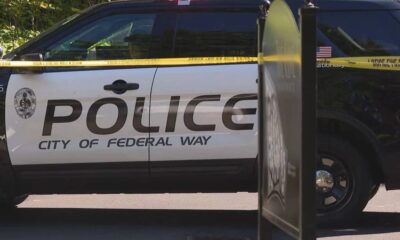 City of Federal Way police SUV with yellow caution tape across the side, cordoning off the area.