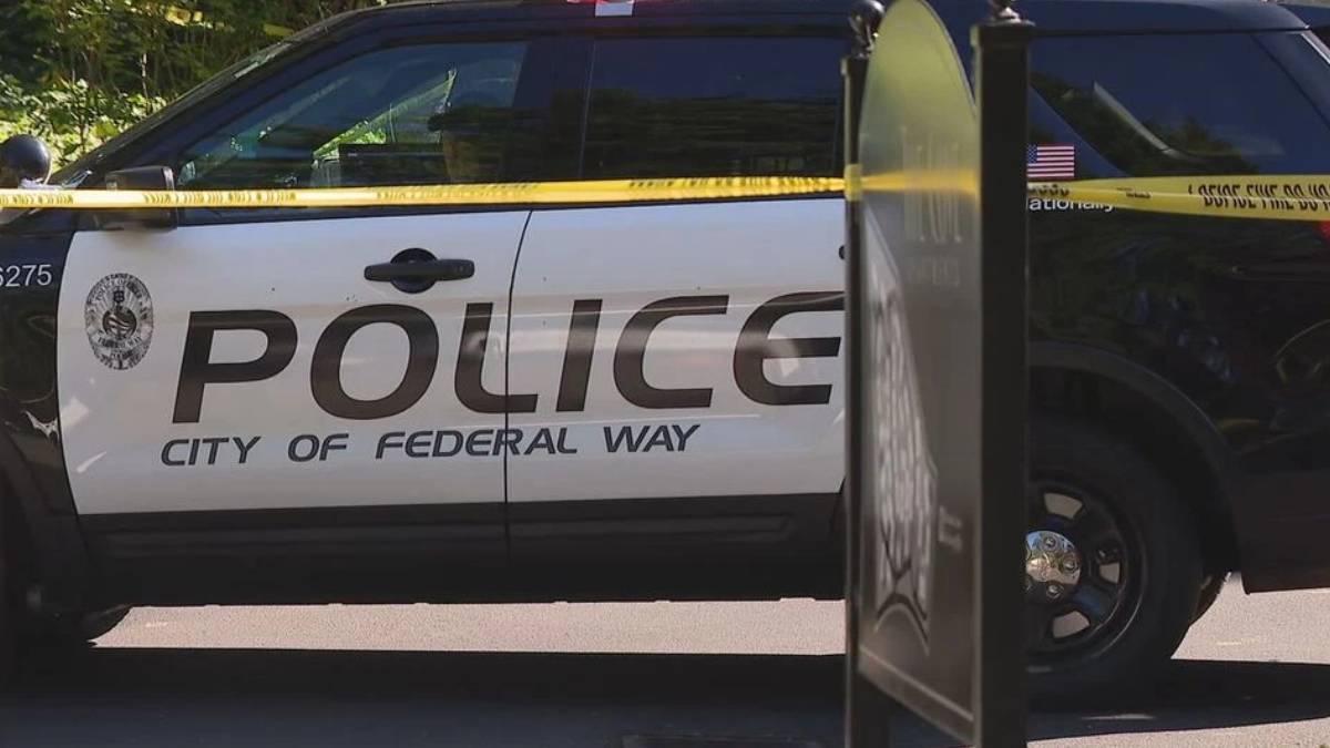 City of Federal Way police SUV with yellow caution tape across the side, cordoning off the area.