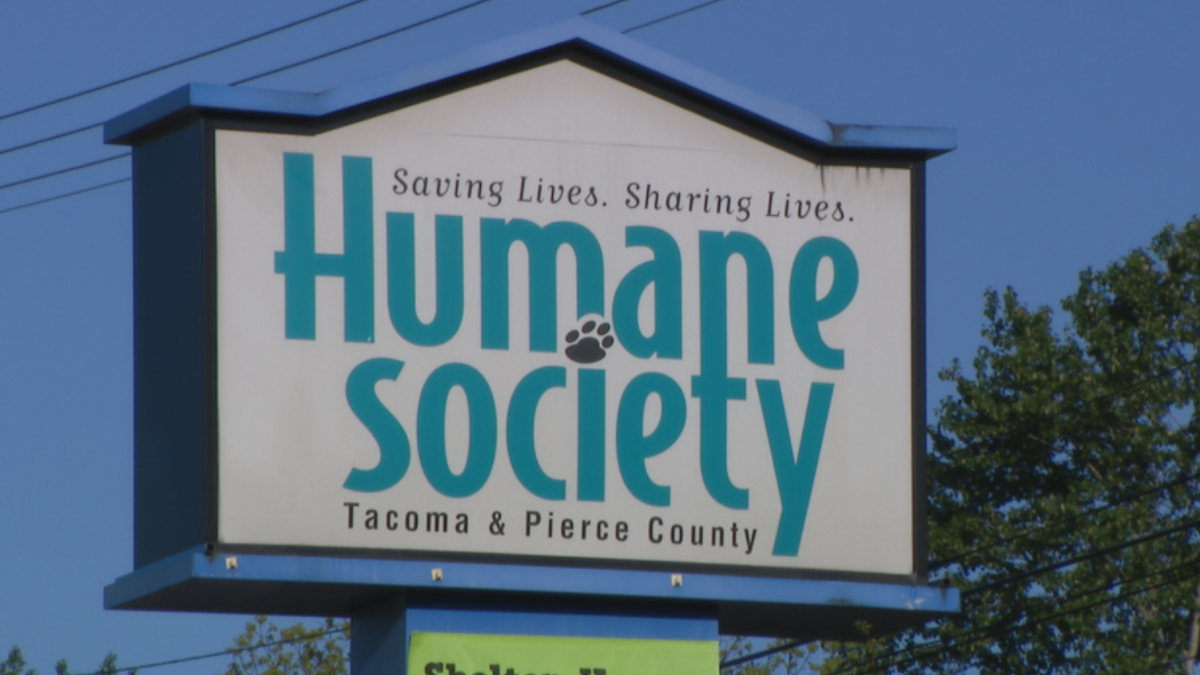 Sign for the Humane Society Tacoma & Pierce County with the slogan Saving Lives. Sharing Lives.