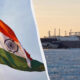 Indian tricolor flag waving on a flagpole with a blue sky, divided from an Arctic icebreaker ship by a curved white seam, suggesting a India-Arctic theme.