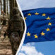 Soldiers in camouflage gear walking through a forest, split by a diagonal white divider from a waving European Union flag against a blue sky; conveys military cooperation in Europe.