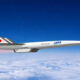 Concept supersonic jet with JAXA branding flying above clouds in clear blue sky, Japan flag on tailfin.