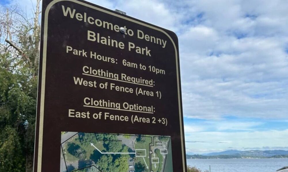 Park sign that reads: Welcome to Denny Blaine Park; hours 6am–10pm; clothing required west of fence (Area 1); clothing optional east of fence (Areas 2+3).