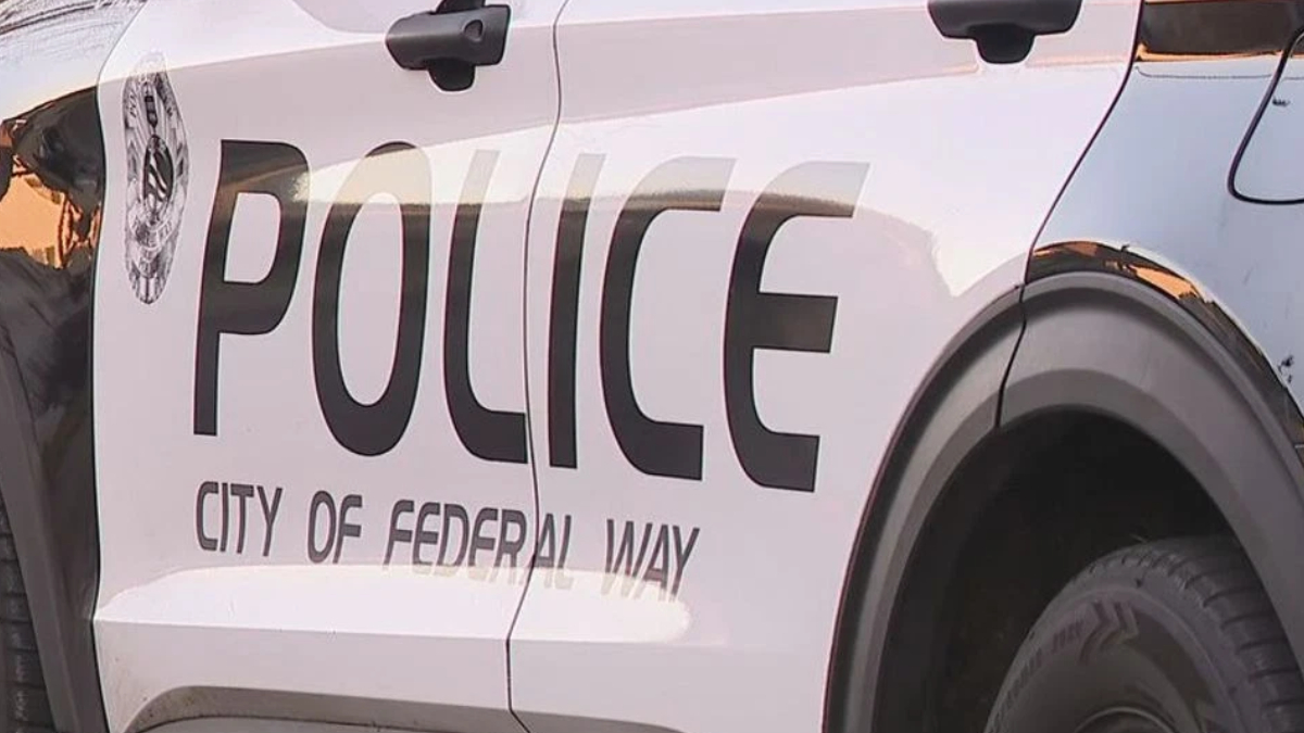 Side view of a white police SUV with large 'POLICE' lettering and 'City of Federal Way' on the door.