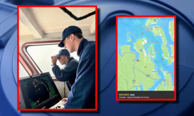 Two sailors on a ship's bridge use binoculars while another stands by a radar screen.