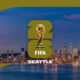 Seattle FIFA World Cup banner showing the trophy above the 'FIFA SEATTLE' text over a city skyline at dusk.