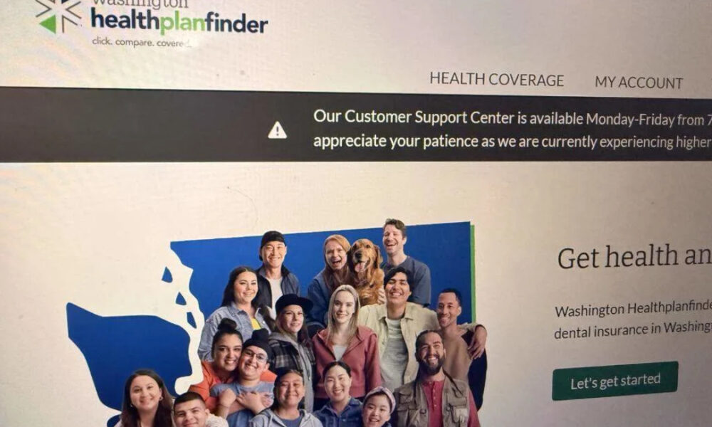 Group photo of diverse people smiling together in front of a blue map graphic on a health insurance website banner (Washington Healthplanfinder).