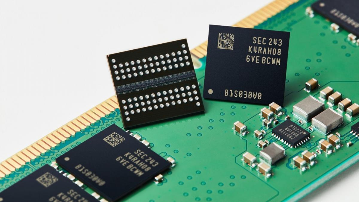 Close-up of memory chips on a green circuit board with a gold edge connector, showing electronic components and circuitry nearby.