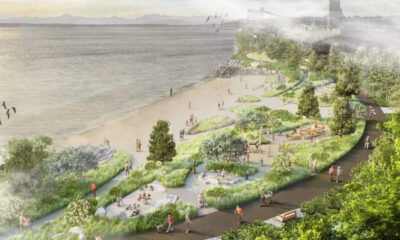 Illustrated waterfront park proposal with a sandy beach, winding paths, and lush greenery along the coast, with people strolling and sitting.