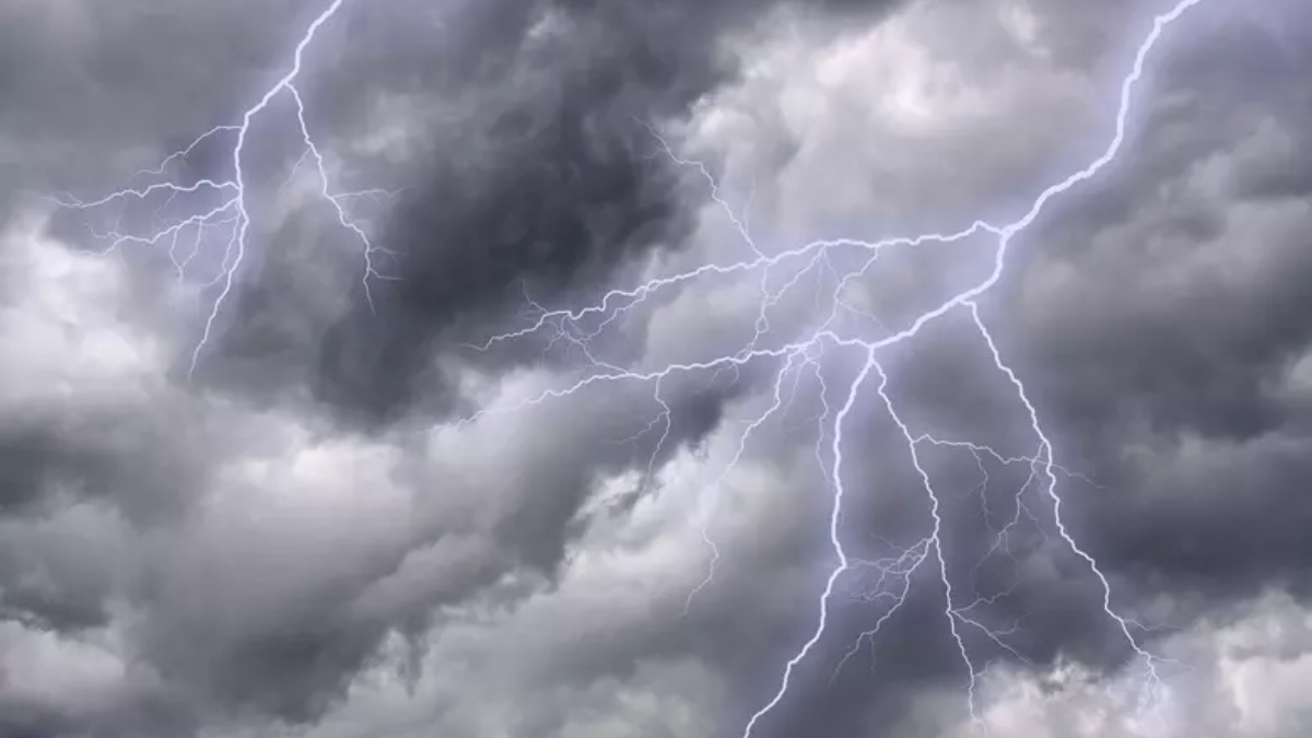 Dark storm clouds with bright jagged lightning bolts streaking across the sky.