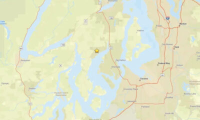 Map with a yellow star marking a location near Gig Harbor, Washington, amid Puget Sound waters and highways.