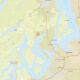 Map with a yellow star marking a location near Gig Harbor, Washington, amid Puget Sound waters and highways.