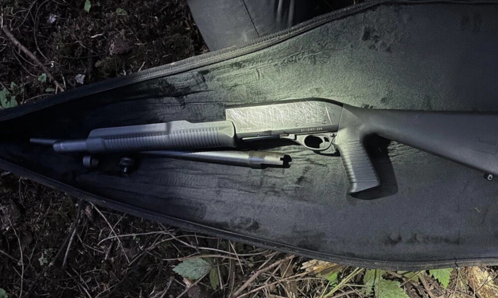 Disassembled shotgun in a padded case, with barrel, receiver, and stock laid out for transport.