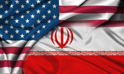 Overlap of the United States and Iran flags, representing US–Iran relations or diplomacy.