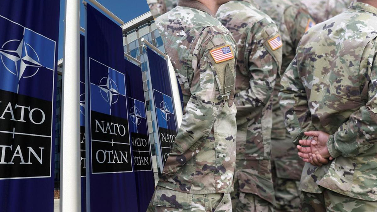 Soldiers in camouflage uniforms stand in line beside large NATO banners outside a building.