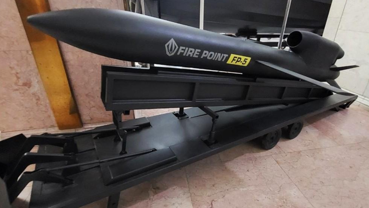 Black Fire Point FP-5 equipment mounted on a wheeled trailer indoors, viewed from the side.