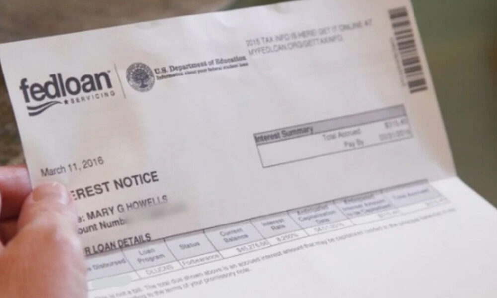 Person holding a FedLoan Servicing loan notice document dated March 11, 2016.