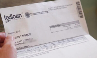 Person holding a FedLoan Servicing loan notice document dated March 11, 2016.