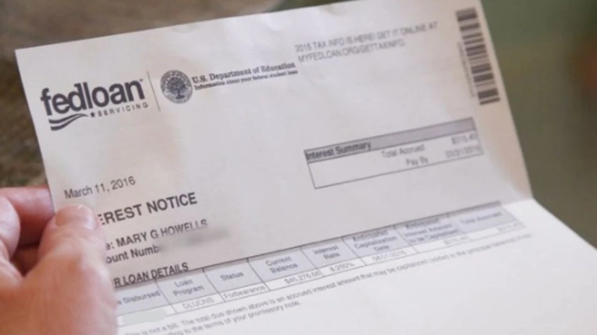 Person holding a FedLoan Servicing loan notice document dated March 11, 2016.