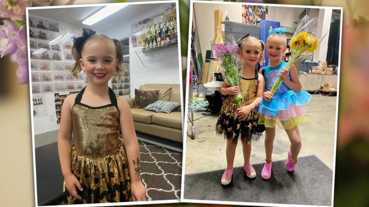 Young girl in a gold sequin dance dress standing in a backstage dressing room, smiling at the camera.