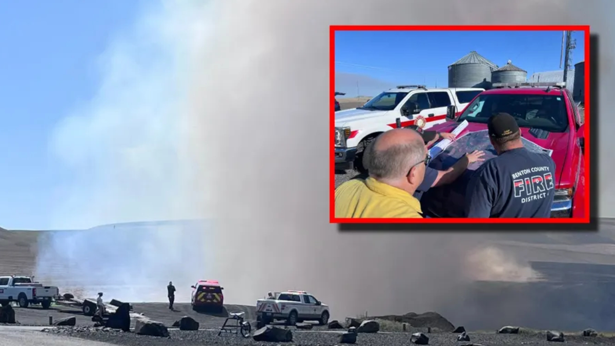 Wide view of a wildfire with thick smoke, emergency vehicles, and security cones on a barren ground. Inset shows firefighters reviewing a map near a red pickup truck, framed in red.