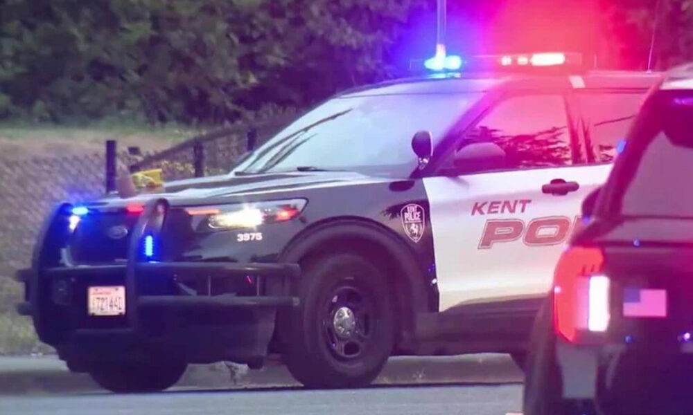 Kent Police SUV with blue and red emergency lights activated on a street, front grille guard visible.