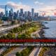 Seattle skyline and waterfront park with a tram along the tracks; red Russian headline about Seattle’s waterfront getting new parks and updated paths and lighting (Slavigo)